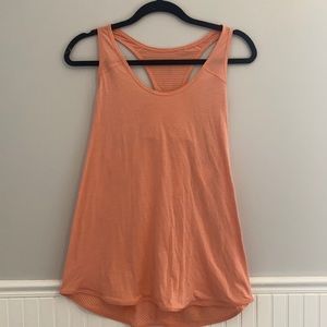 Orange Lululemon workout tank top.